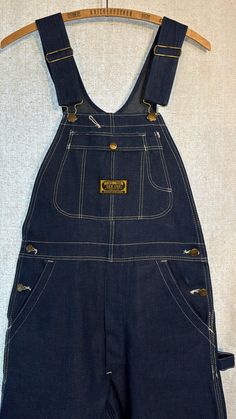 Gorgeous pair of old denim overalls, never worn! They have some light marks (see photos). No bad smells!  Labeled 29" x 36", actual measurements: Waist 30" Seat 46" Thigh 25" Hem 20" Front rise 13" Back rise 14" (from where the bottom of the waist is in the front) Inseam 36" Outseam 47" Please note that I don't accept returns if the item doesn't fit, unless I've made a huge mistake in the measurements or description. Please make sure to read the description and check the measurements carefully a Vintage Cotton Medium Wash Shortalls, Retro Cotton Dark Wash Shortalls, Retro Dark Wash Cotton Shortalls, Vintage Blue Shortalls, Vintage Denim Shortalls In Medium Wash, Vintage Denim Blue Cotton Shortalls, Vintage Denim Shortalls, Vintage Style Medium Wash Denim Shortalls, Vintage Medium Wash Denim Shortalls