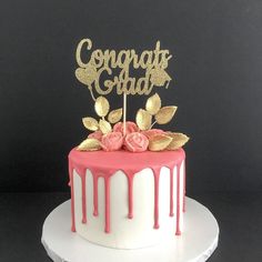 a white cake with pink and gold frosting on top that says sagery's fabulous birthday