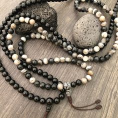 Beautiful black and mix Agate Japa Mala from Nepal. You can choose between the Black Agate mala and the Mix Agate mala necklace. A unique praying mala that can be used as a necklace or as an ornament. The mala has no clasp, you wear it over the head. The mala necklace is 42.5cm- 16.75 inch long A most have addition to your jewelry collect To see more unique Mala necklaces click the link below https://www.etsy.com/shop/AkashiJewelry?ref=seller-platform-mcnav&section_id=18307945 Enjoy Con salu Black Agate Gemstone Beads, Adjustable Agate Hand-strung Mala, Adjustable Hand-strung Agate Mala, Black Polished Beads Necklace For Healing, Agate Beaded Bracelets With 108 Beads For Meditation, Spiritual Agate Mala With Round Beads, Black Agate Round Beads Necklace, Adjustable Agate Mala With Round Beads, Adjustable Black Mala With Round Beads