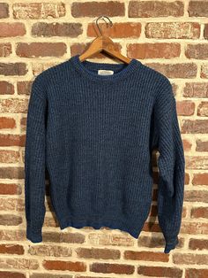 "You're looking at a vintage navy blue sweater by Saugatuck. This sweater is in great vintage condition. It's a nice mid weight and has a nice rugged texture and feel. The sweater is blue, black and navy blue with a blue trim on the collar, cuffs and waist. Looks even better in person  See measurements for proper fit  Approx Measurements- Armpit to Armpit- 20.5\" Shoulder- 22\" Sleeve- 21.5\"  Length- 23\"" Classic Blue Crew Neck Sweater, Classic Blue Crew Sweater, Classic Blue Ribbed Sweater, Blue Textured Knit Wool Sweater, Vintage Knit Sweater With Ribbed Collar, Blue Retro Crew Neck Sweater, Retro Blue Crew Neck Sweater, Vintage Blue Crew Neck Sweater, Vintage Crew Neck Sweater With Ribbed Collar