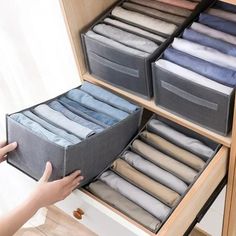 the drawers are filled with folded linens