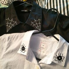 two black and white shirts with spider webs on them, one has an eye patch