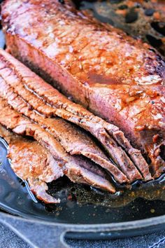 some meat is cooking in a skillet on the stove top and it looks like they have been cooked