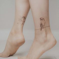 two birds on a wire tattoo on both legs, one bird sitting on the line