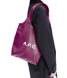 A.P.C. tote bag. - Unisex model. - Recycled leather-look material. - Two large handles. May be carried by hand or on shoulder. - Interior pocket. - White A.P.C. logo. - Part of the Ninon line of products. Small Tote Bag, C Logo, Recycled Leather, Small Tote, Free Bag, Cotton Style, Small Bags, You Bag, Pretty Things