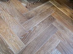 an image of wood flooring that looks like herringbones