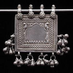 Antique die-stamped silver amulet box container pendant of rectangular shape with dangles. Depicting two peacocks and a Rajput-style cusped-arch. From India. Worn. Good condition. Collectible and useful as jewelry supplies. Measures (without dangles): 41,5 x 46,2 mm. Weight: 34 grams. Silver Jewellery Indian, Carnelian Beads, Crown Jewels, Amulets, Peacocks, Ethnic Jewelry, Jewelry Inspo, Jewelry Supplies, Artifacts