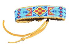 This is a combination of a traditional Wetland design that I found in an old loom Native American design book combined with my original design on tanned deer hide. I used the smaller size 15 beads instead of the traditionally used size 11 beads, making for a clearer resolution.  After I beaded it on a loom, I sew it onto soft deer hide leather. Closes with an adjustable jade sliding stone.  Contains about 1200 seed beads.  It looks great on both men and women.   It closes at 6.5", but is expandable for larger wrist sizes.   Contact us if you'd like a custom size or changes made. Custom work prices vary.   Please note that in the picture, it closes with a pine bead, but I have changed it to a jade stone closing clasp. It's much stronger and more attractive.  Pictures to come! Traditional Brown Friendship Bracelets For Festival, Traditional Brown Beaded Friendship Bracelets, Bohemian Turquoise Beaded Bracelets For Festivals, Handmade Turquoise Beaded Bracelets For Festivals, Traditional Blue Handwoven Beaded Bracelets, Blue Southwestern Beaded Bracelets For Festival, Southwestern Style Blue Beaded Bracelets For Festival, Bohemian Blue Cuff Bracelet With Colorful Beads, Artisan Blue Cuff Bracelet For Festivals