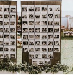 two wooden boards with pictures on them sitting in the grass