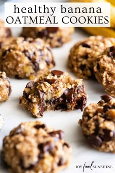 healthy banana oatmeal cookies on a white plate with bananas in the background