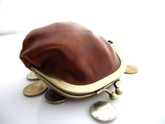 Portable Leather Pouch Wallet, Travel Clutch Coin Purse With Coin Pocket, Brown Clutch Coin Purse As Gift, Brown Clutch Coin Purse Gift, Brown Coin Purse With Interior Card Slots, Compact Brown Leather Bag, Leather Coin Purse In Pouch Shape, Brown Coin Purse With Coin Pocket For Travel, Compact Brown Bag With Coin Pocket