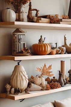 the shelves are filled with pumpkins and other decorations