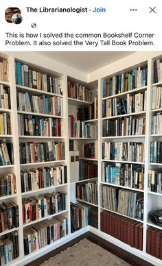 a room filled with lots of books on top of white shelving unit units next to a carpeted floor