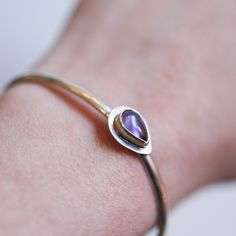 Something perfect about this open-back cuff bracelet in natural AAA Purple Amethyst. Stack it with other bracelets.  This style bracelet is also available in Chrysoprase, Kyanite and Charoite - as seen in photo - sold separately. Coordinating Earrings sold separately.  This listing is for ONE AAA Purple Amethyst bracelet - choose your size in the drop-down. The royal elegance of Purple Amethyst is undeniable and elusive. This dressy Amethyst bracelet is no different. We've surrounded the gorgeou Purple Amethyst Bangle, Amethyst Cuff Bracelet In Purple For Gift, Amethyst Cuff Bracelet As Gift, Purple Amethyst Cuff Bracelet Gift, Amethyst Gemstone Bangle, Spiritual Amethyst Cuff Bracelet In Purple, Modern Purple Bracelet As Gift, Spiritual Purple Amethyst Cuff Bracelet, Amethyst Bangle Gift