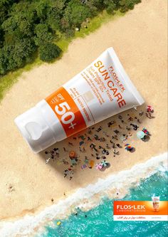 sunscreen on the beach with people standing in the sand and water around it, from above