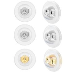 four white and gold buttons on a white background