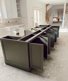 an empty kitchen with cabinets and counters in it