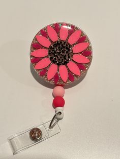 "This adorable 2\" badge reel features a rose gold glitter, leopard print center, and customizable flower petal colors. With a rotating alligator clip back and matching beaded retractable line, it's perfect for nurses, teachers, administrators, and anyone with a badge ID card.  Please message me with questions or custom requests! Flower measures 2\"x2\" 3 10mm matching beads Retractable badge reel Rotating alligator clip attachment Please note: All badge reels are made to order and take 2-3 days processing. As they are custom made, there may be color variation in the glitter. These are acrylic and resin design - while they are durable, they aren't invincible. Dropping may result in breaking." Diy Badge Reel How To Make Epoxy, Acrylic Badge Reels Diy, Pink Badge Reel With Swivel Clip As Gift, Customizable Adjustable Pink Badge Holders, Customizable Adjustable Pink Badge Reel, Badge Reels Diy, Epoxy Design, Badge Ideas, Leopard Flower