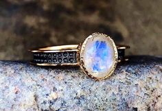 Elegant, vintage, handcrafted, genuine rainbow moonstone rings, 18k gold plated 925 sterling silver. Surface size: 9*7 mm. Band width: 3 mm. Stone weight: 1 grams. Sizes: 6, 7, & 8. Hand Forged Gold Moonstone Rings, Gold Moonstone Hallmarked Rings, Gold Hallmarked Moonstone Rings, Hand Forged Gold Oval Moonstone Ring, Hand Forged Oval Moonstone Ring, Handmade 14k Gold Oval Moonstone Ring, Oval Hand Forged Moonstone Ring For Anniversary, Handmade Oval Moonstone Ring In 14k Gold, Hand Forged Oval Moonstone Ring For Anniversary