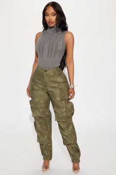 Available In Charcoal And Olive. Washed Faux Leather Jogger High Rise Button & Zip Closure Hand & Back Pockets Cargo & Utility Details Non Stretch Coating: 100% Polyurethane Base Fabric: 100% Polyester Imported | Harvey Washed Faux Leather Cargo Jogger Pant in Olive Green size Medium by Fashion Nova Leather Jacket Cargo Pants Outfit, Vegas Shopping, Green Top Outfit, Chic Street Wear, Tan Cargo Pants, Olive Fashion, Texas Houston, Leather Joggers, Fashion Dictionary