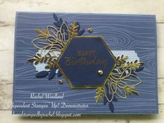 a blue birthday card with gold foil leaves and a hexagonal frame on it