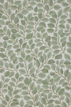 a green and white wallpaper with leaves on it