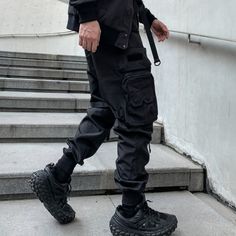 Embrace the spirit of Japanese techwear & army clothing with these game-changer Tactical Pants. Meet the Tactical Techwear Pants, a groundbreaking fusion of style and function tailored for the discerning urban dweller. As you stride confidently through the city, these avant-garde pants effortlessly communicate your distinct fashion sensibilities, commanding attention from all who pass by. These tactical joggers are the epitome of urban fashion, a unique combination of Japanese techwear design an Techwear Cargo Pants, Black Techwear, Loose Leggings, Ninja Pants, Hip Hop Joggers, Techwear Pants, Cargo Pants Style, Harajuku Punk, Tactical Wear