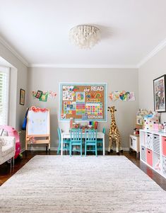 a child's room with toys and decor on the walls