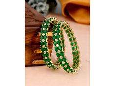 Elevate your elegance with our Designer 2 Pair Bangles. Crafted with exquisite CZ and emerald green gold accents, these bangles radiate sophistication. Each piece adorned with American diamonds, they exude luxury and charm. Perfect for adding a touch of glamour to any ensemble, a must-have for your jewelry collection. Bangles Se (2 Pc) Sizeable Bangles Crystal Stone *SHOP LINK - https://www.etsy.com/shop/ColourstoneWorld?ref=profile_header * PERFECT GIFT FOR LOVED ONES DELIVERY UPGRADE AVAILABLE IF YOU HAVE ANY QUESTIONS PLEASE FEEL FREE TO ASK We Can Take Custom Orders Also As Per Your Requirement. ColourstoneWorld Jewelry Pieces Can Be Customized As Per Your Requirement. SHOP LINK - https://www.etsy.com/shop/ColourstoneWorld?ref=profile_header Afghani Jewelry - https://www.etsy.com/shop/ Indian Bangle Bracelets, Afghani Jewelry, Gold Bangles Indian, Wedding Jewelery, Bangles Indian, Profile Header, Crystal Bangle, Jewelry Crystal, Hindu Wedding