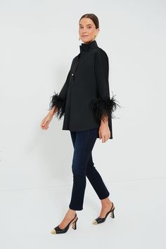 Our favorite blouse gets the ultimate glam girl update: feathers! The Willow has the perfect stand collar and gorgeously feathered sleeves to create a party piece that can be worn with effortless ease. Complete with a boxy but not oversized fit, this pullover can be styled with everything from denim to leather for glamorous get-togethers and cocktail parties this season! Stand collar Three-quarter length sleeves Feather cuffs Half-placket neckline Gold ball button Boxy fit Material: 100% Polyest Feathered Sleeves, Feather Cuffs, Glam Girl, Cocktail Parties, Black Feathers, Black Blouse, Cocktail Party, Stand Collar, Three Quarter