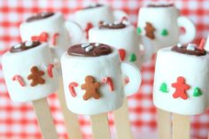 marshmallows decorated with gingerbread and chocolate on sticks