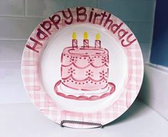 a plate with a birthday cake on it