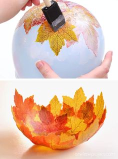 a hand holding a paintbrush over an autumn leaf painted bowl with leaves on it