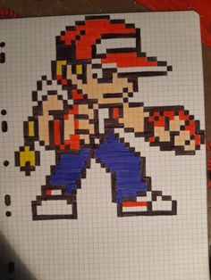 a drawing of an old school video game character made out of legos on a sheet of paper