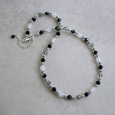 "Classic black, white and gray necklace made with jet black and black diamond (gray) Swarovski crystals, white agate stones and antique silver pewter accents. Sterling silver lobster clasp. 2\" extender with black and crystal charm drop. ❖ Swarovski crystals ❖ White agate stones ❖ silver plated pewter ❖ sterling silver Necklace shown is 16\" in length with a 2\" extender. ⊱✿ Matching earrings: https://www.etsy.com/listing/613154830/black-and-white-earrings-swarovski?ref=shop_home_active_1 ⊱✿ Mat Black Necklace Beaded, Black White Necklace, Black And Silver Necklace, Black And White Necklaces Beads, Black And Silver Jewelry, Black And White Beaded Necklace, Black Crystal Necklace, Black And White Necklace, Crystals White