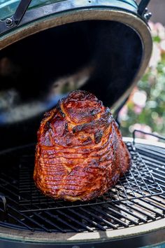 a piece of meat is being cooked on the grill