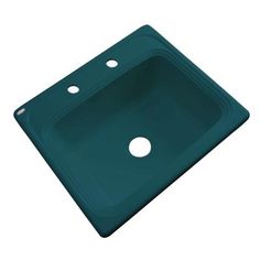 a green sink with two holes in the middle