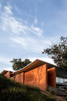 the house is made out of wood and has stairs leading up to it's roof