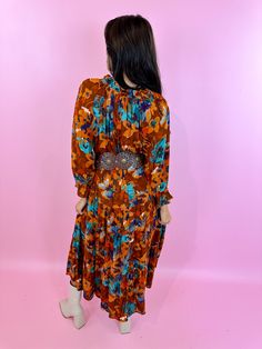 Orange with teal florals Tie closure at neckline Pleated Femme Ruffles Flowy silhoutte Gauze Fabric 100% Rayon Retro Floral Print Maxi Dress For Fall, Retro Floral Print Dress For Fall, Gauze Fabric, Floral Midi Dress, Pitcairn Islands, Mozambique, Floral Maxi Dress, Ruffles, Midi Dress