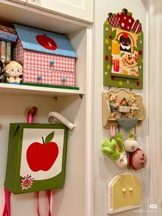 there are many items on the wall in this room, including toys and magnets