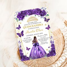 a purple and gold quinceauera themed birthday party with flowers on the table