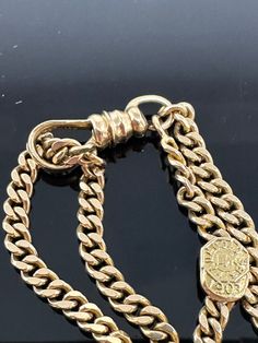 Unique Late Victorian 14k Yellow Gold Slider Watch Chain Necklace Material: 14k Yellow Gold Necklace length if worn single: 41 inches  Necklace length if worn doubled: 20,5 inches Chain width: 3.12 mm Total weight: 47.1 grams Time period of origin: 1907 (late Victorian) - see pictures Company: Baumgold Brothers Marks: raised lettering on the small shield on the chain reads - Baumgold Brothers, 1907, 14k Move the engraved slide up and down to create different styles and lengths of the necklace. You can also add a charm or pendant on the clasp. You can wear this chain either doubled or single layered. We have a GIA gemologist on our team. All jewelry items are authenticated. Gold Slides, 14k Yellow Gold Necklace, Yellow Gold Necklace, Watch Chain, Time Period, Necklace Length, Chains Necklace, Different Styles, Necklace Etsy