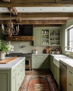 a kitchen with green cabinets and an area rug in front of the stove top oven