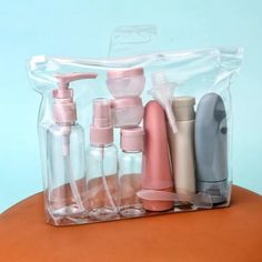 a clear bag filled with lots of different types of soaps and lotion bottles