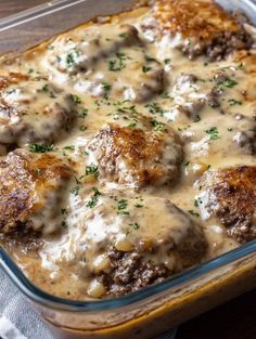 a casserole dish with meatballs and gravy