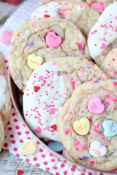 valentine's day cookies with sprinkles and hearts in a bowl