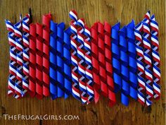 red, white and blue paper straws arranged in the shape of american flags