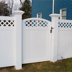 an image of a white fence in front of a house