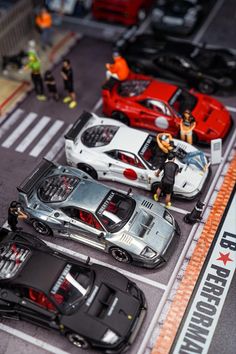 toy cars are lined up in a parking lot