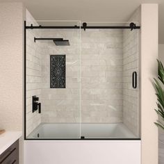 a bathroom with white tile and black accents